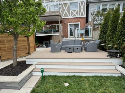 multi-level deck attached to rear side of home