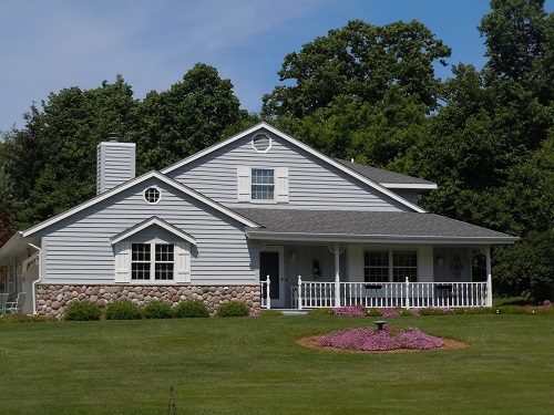 Gray Siding with White Trimwork and White Shutters
