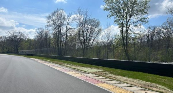 CertaPro painting the two metal crash walls at Road America