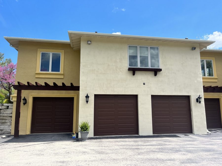 Stucco home exterior and pergola painting in Fond du Lac, WI