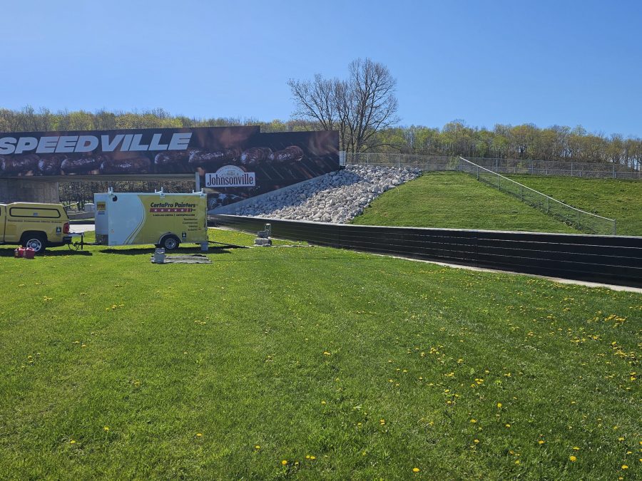 CertaPro painting the two metal crash walls at Road America Preview Image 2