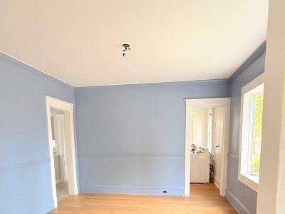 blue painted home interior room with wood floors
