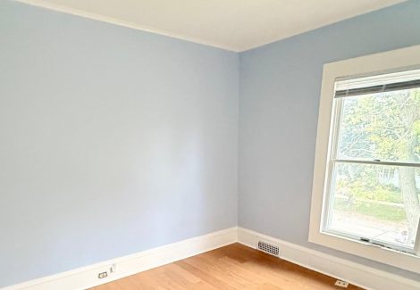 blue painted home interior room with wood floors