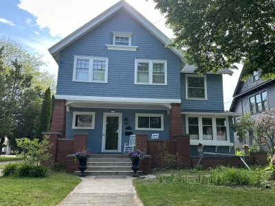front of house with blue painted cedar shake siding