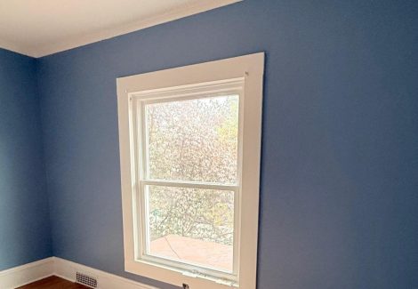 blue painted home interior room with wood floors