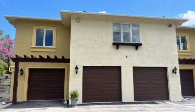 Stucco home exterior and pergola painting in Fond du Lac, WI