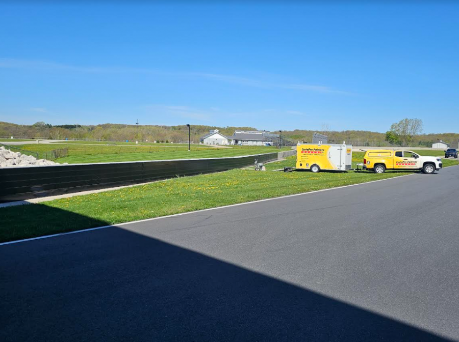 CertaPro painting the two metal crash walls at Road America Preview Image 1