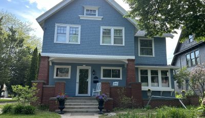 front of house with blue painted cedar shake siding