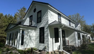 front corner of white painted house