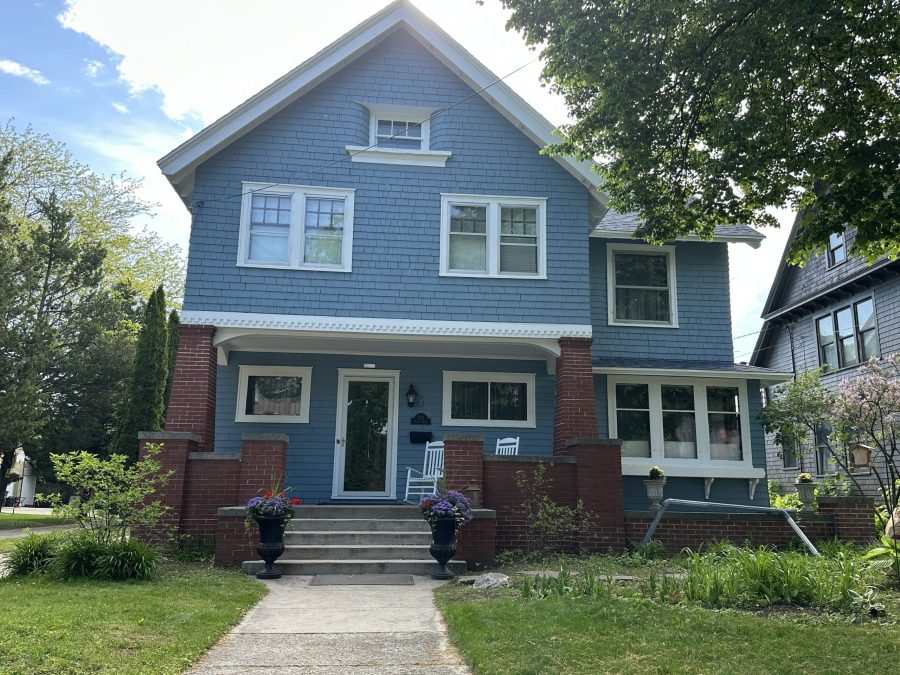 front of house with blue painted cedar shake siding