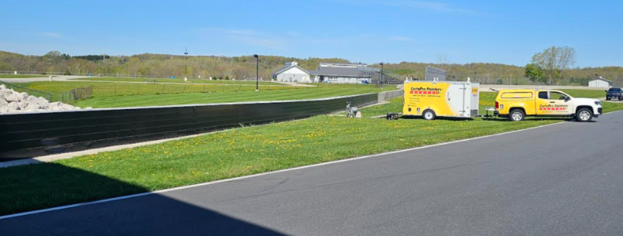 CertaPro painting the two metal crash walls at Road America Preview Image 6