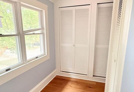blue painted home interior room with wood floors
