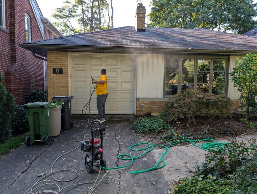 painter power washing home garage door Preview Image 2
