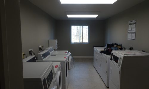 After Photo of Laundry Room Repainted Light Gray