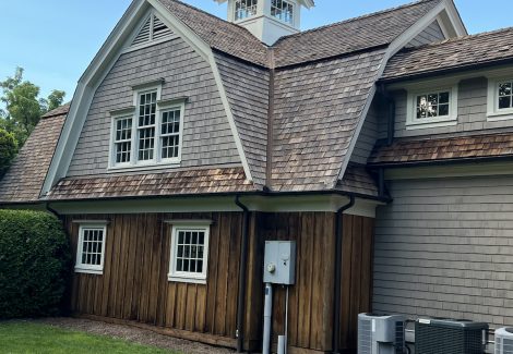 Gambrel roof and side elevation of house repainted in Westport.