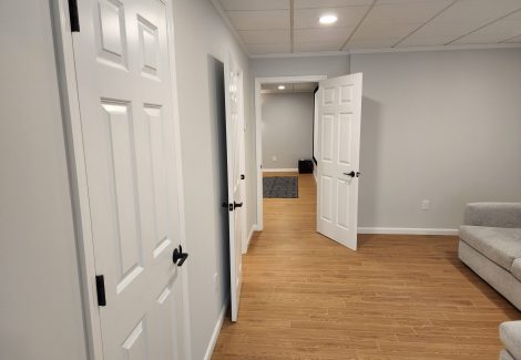 A very light gray wall paint paired with white trim.