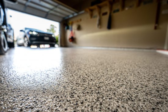 Residential garage with concrete flooring with an epoxy finish