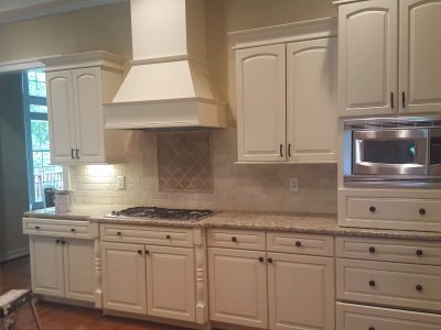Kitchen with white cabinets repainted by CertaPro