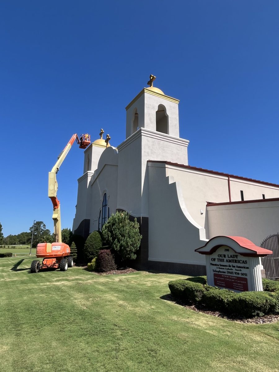 CertaPro Painters of Fayetteville crew member painting exterior of church in Candor, NC - Angle 2 Preview Image 1