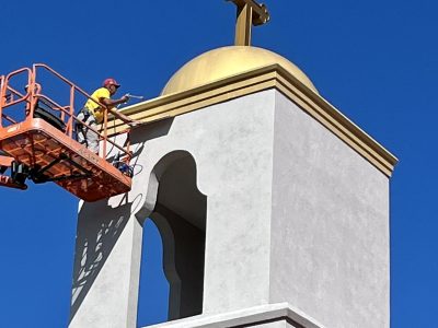CertaPro Painters of Fayetteville crew member painting exterior of church in Candor, NC