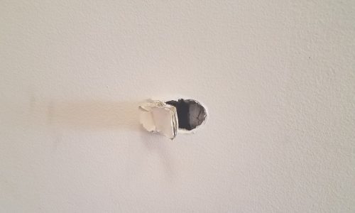 nail in drywall needing repair