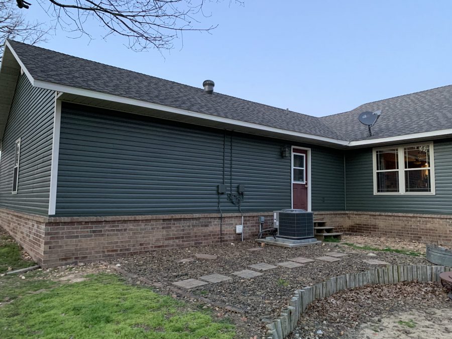 blue/green painted siding with white trim Preview Image 3