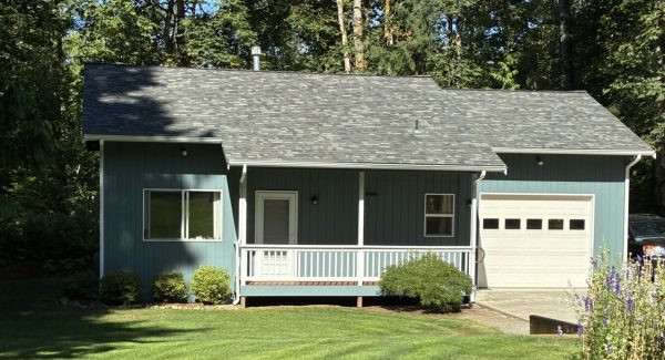 front of house with blue siding and white trim