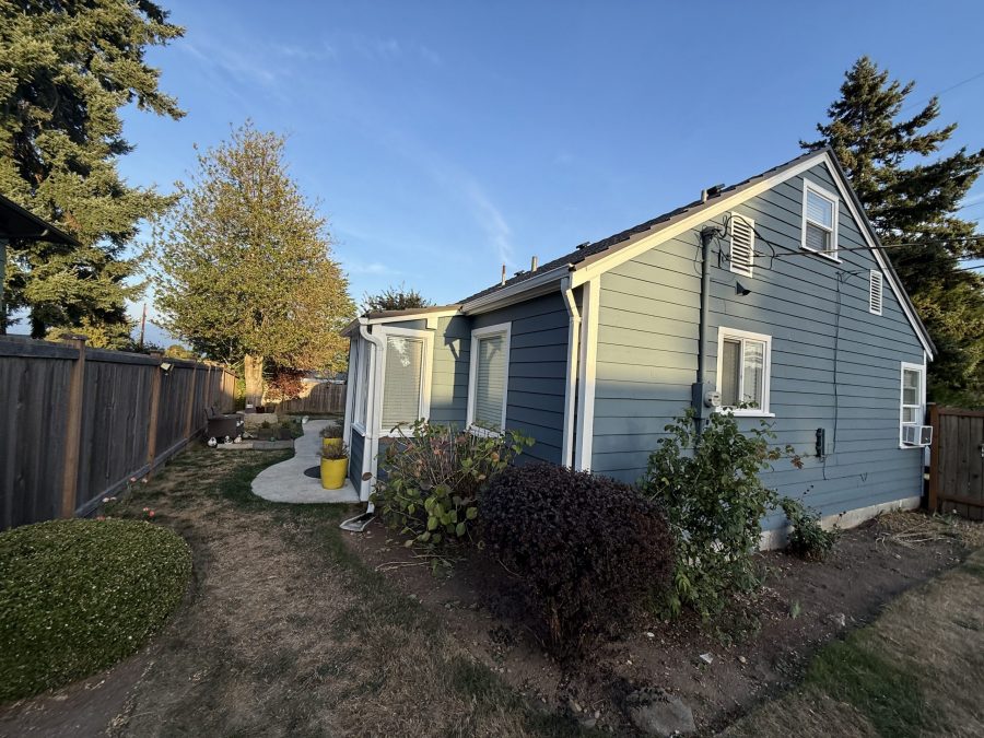 house and detached garage with repainted cedar siding Preview Image 3