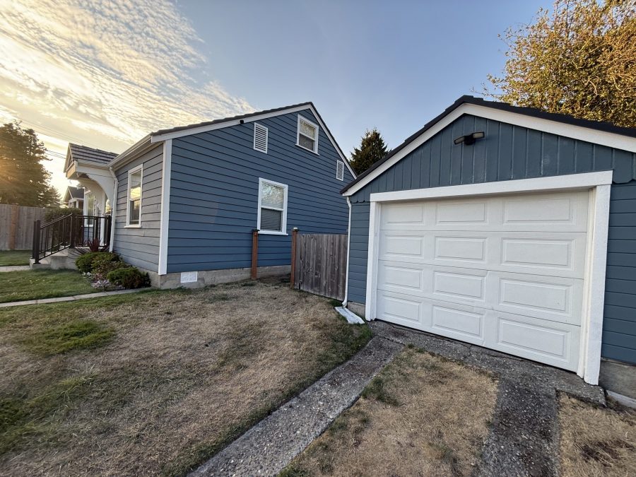 house and detached garage with repainted cedar siding Preview Image 1