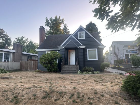 house with blue painted siding and white trim