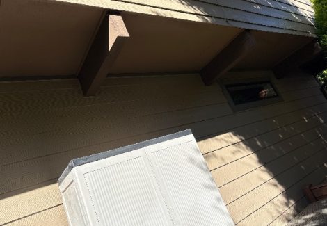 soffits and siding on house exterior before repaint
