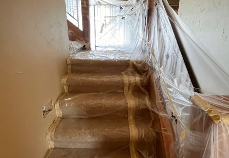 home interior with protective plastic during repaint