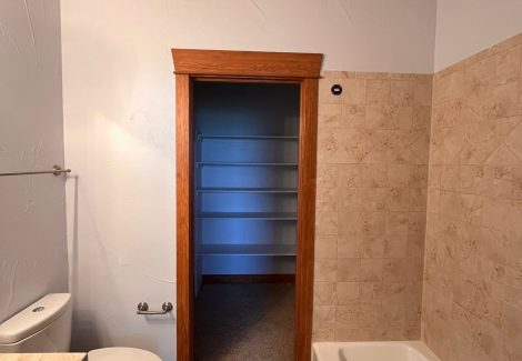 home bathroom interior with painted walls and stained beams