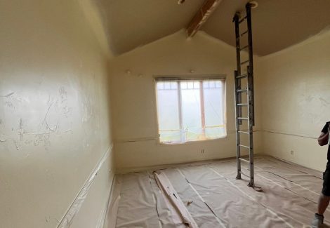 home interior with protective plastic during repaint