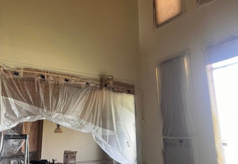 home interior with protective plastic during repaint
