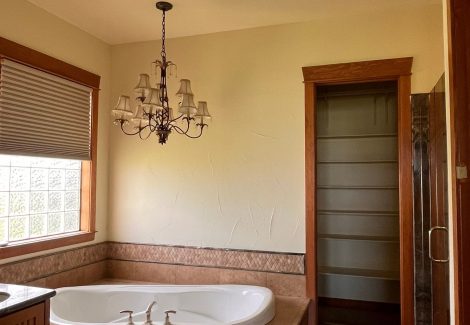 home bathroom interior with painted walls and stained beams