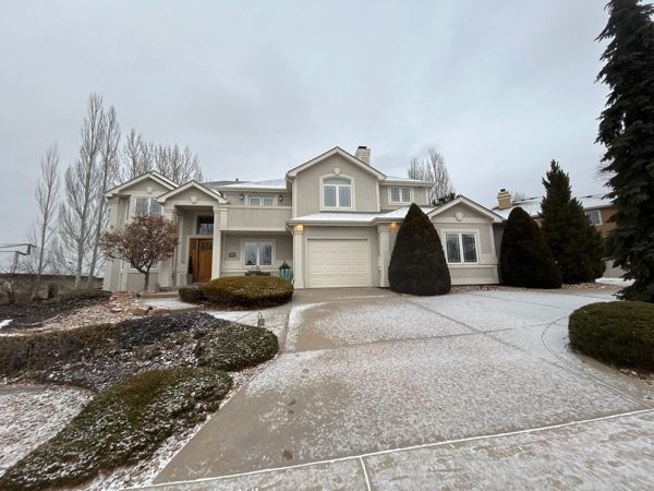 front of stucco house and snow coated driveway Preview Image 7