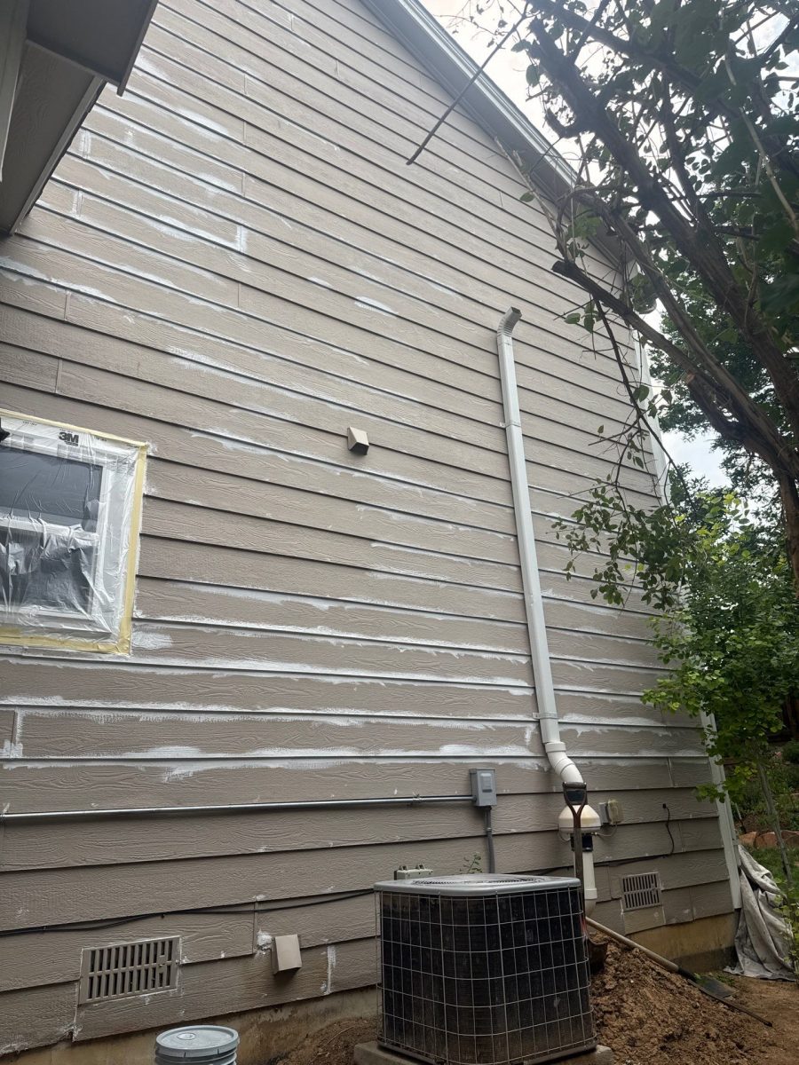 house with worn tan siding and patching Preview Image 13