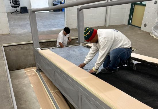 painters working on equestrian treadmill during repaint