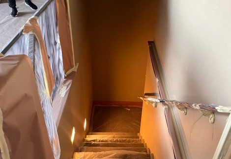 home interior with protective plastic during repaint