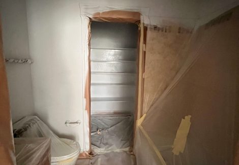 home interior with protective plastic during repaint