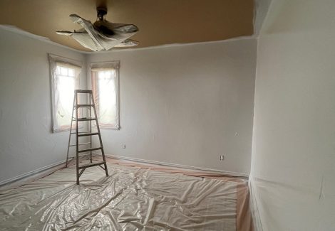 home interior with protective plastic during repaint