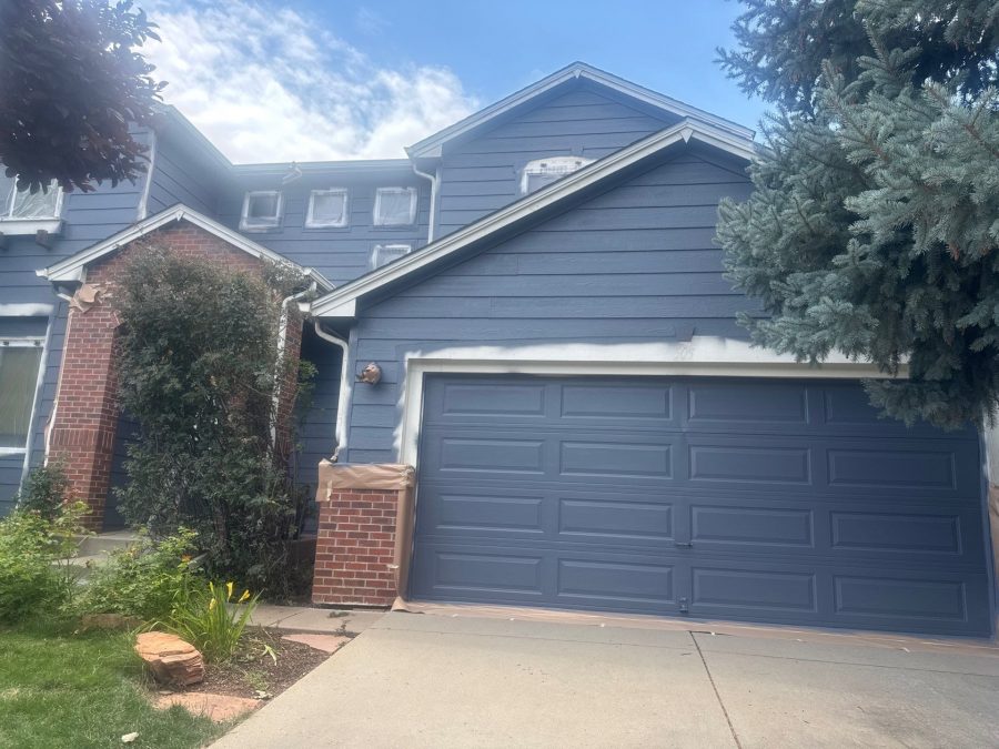 front of house with partially finished painted siding Preview Image 8
