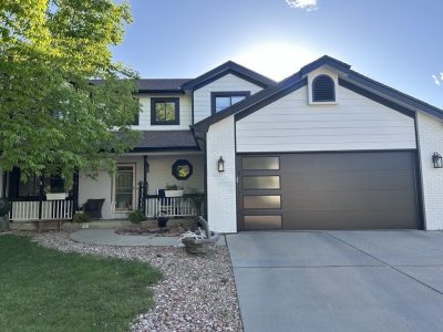 view of painted front of house with garage and driveway