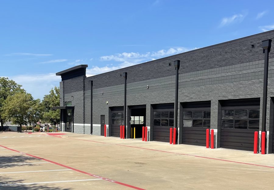 gray black painted Safelite building exterior with bright red bollards in Fort Worth TX Preview Image 2