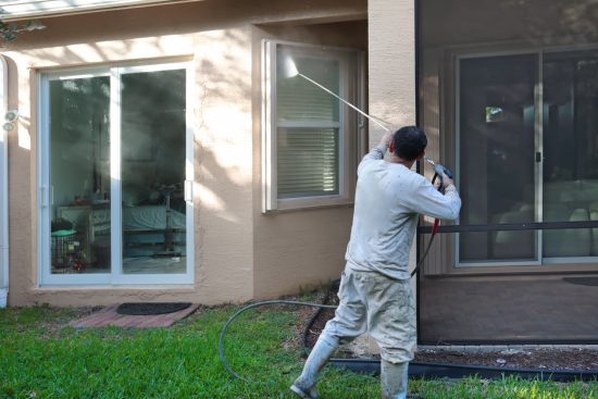 Commercial Power Washing Services washing the side of a condo building