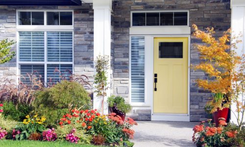 Home Exterior Entryway with Yellow Door