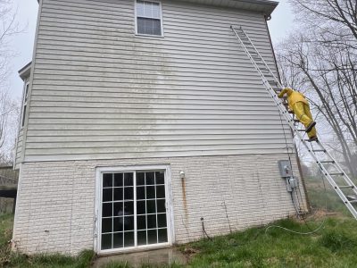 home with white siding before power washing