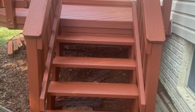 painted outdoor wood steps leading to deck