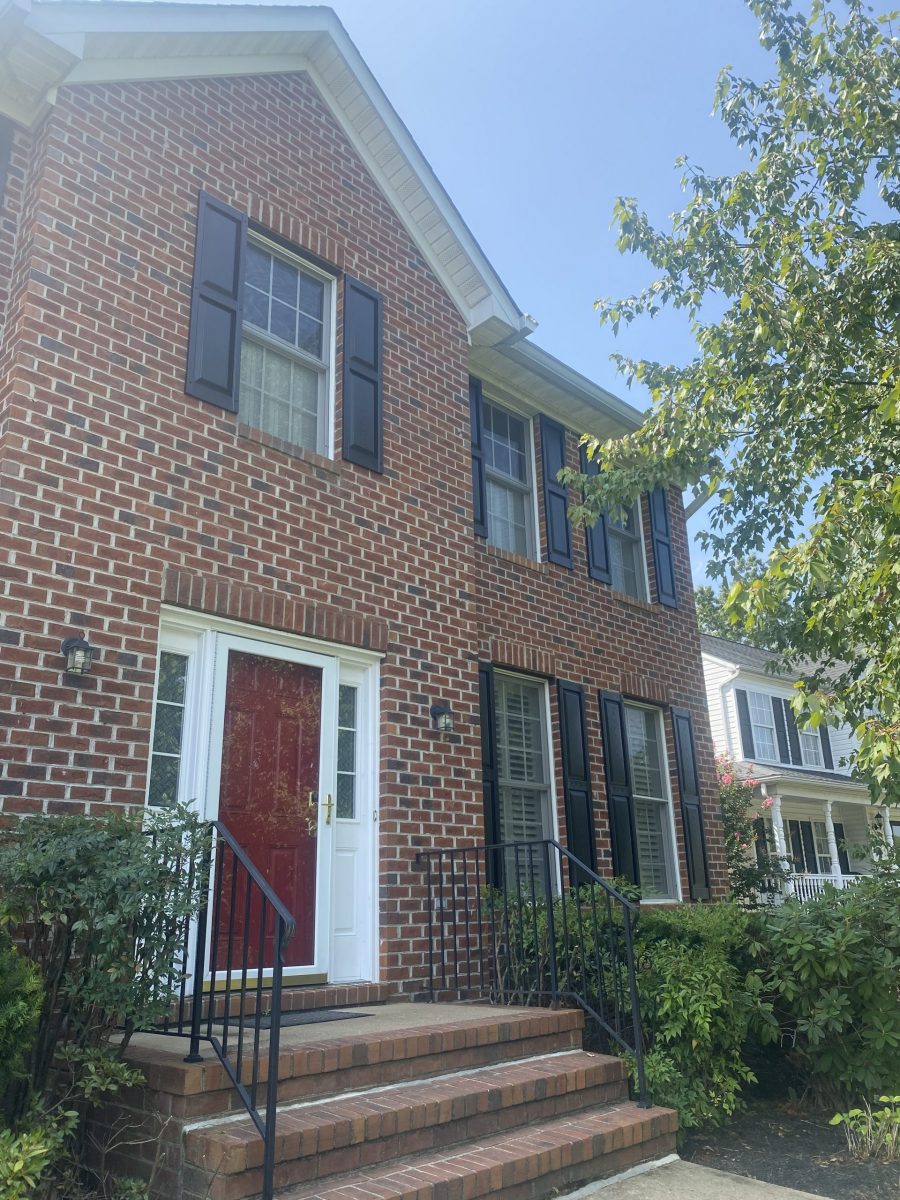 red front door on brick house